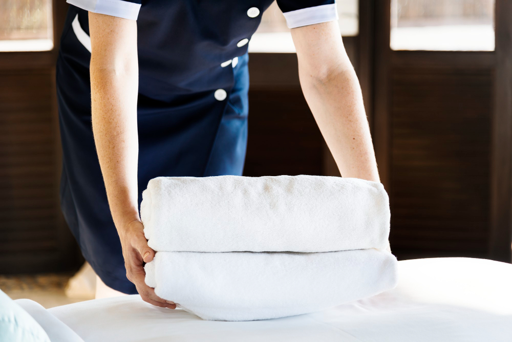 housekeeper-cleaning-hotel-room